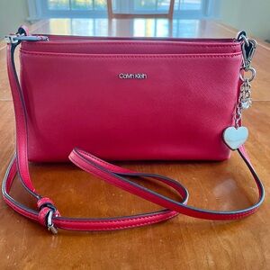 NWOT Calvin Klein Coral Red Crossbody or Shoulder Bag with Silver Heart Charm.